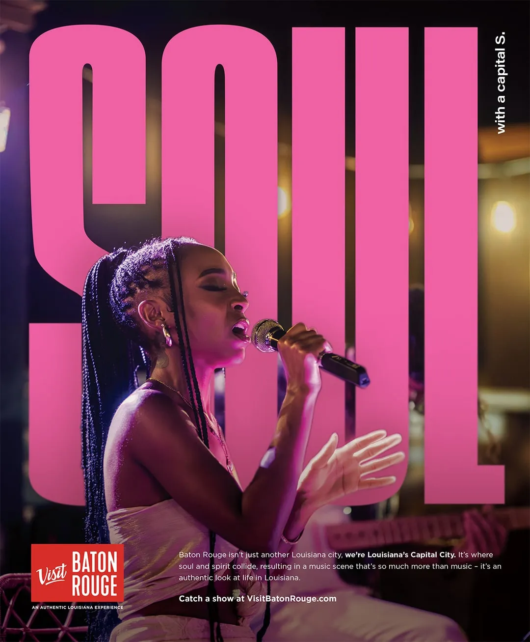 A Visit Baton Rouge print ad reading Soul with a capital S, showing a singer performing on stage