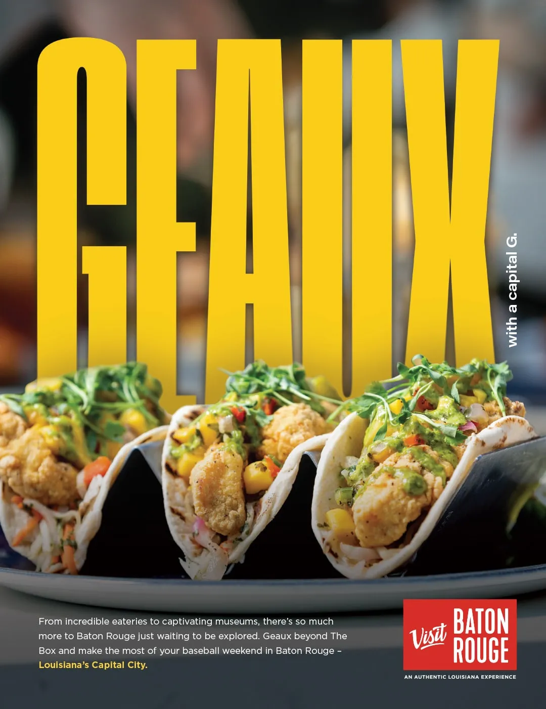 A Visit Baton Rouge print ad reading Geaux with a capital G, showing shrimp tacos