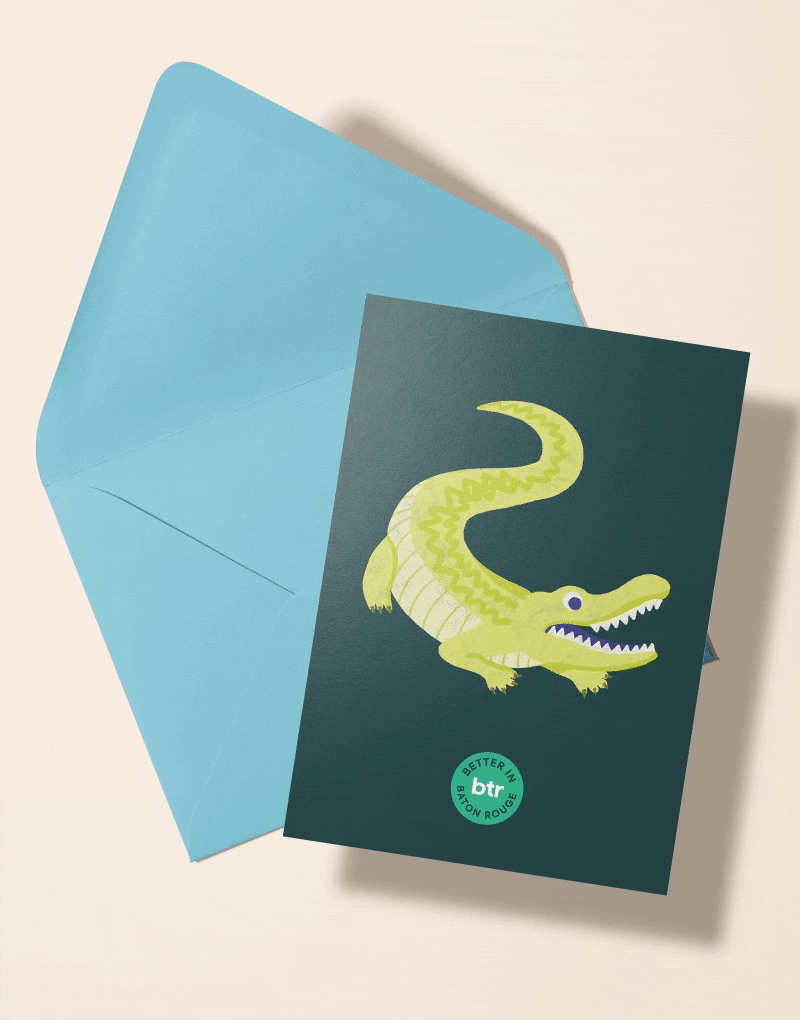 A Better in BTR postcard illustrated with an alligator, beside a blue envelope