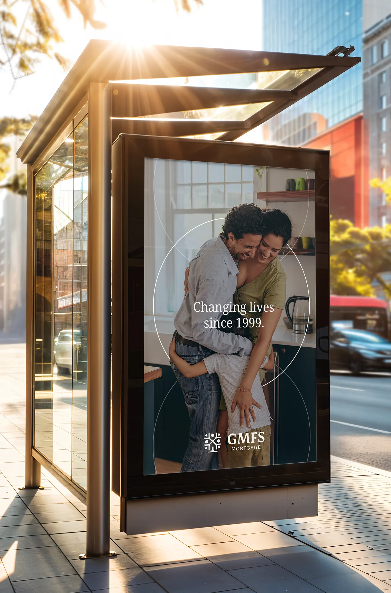 A GMFS advertisement in a bus shelter reading Changing Lives Since 1999