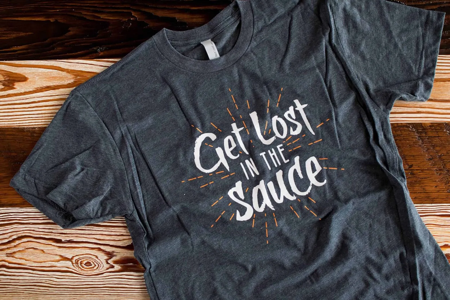A navy LIT Pizza t-shirt reading Get Lost in the Sauce