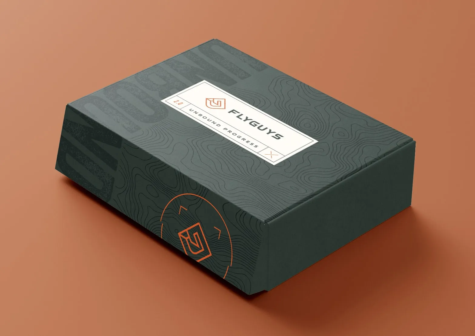 A dark green FlyGuys branded box on an orange background