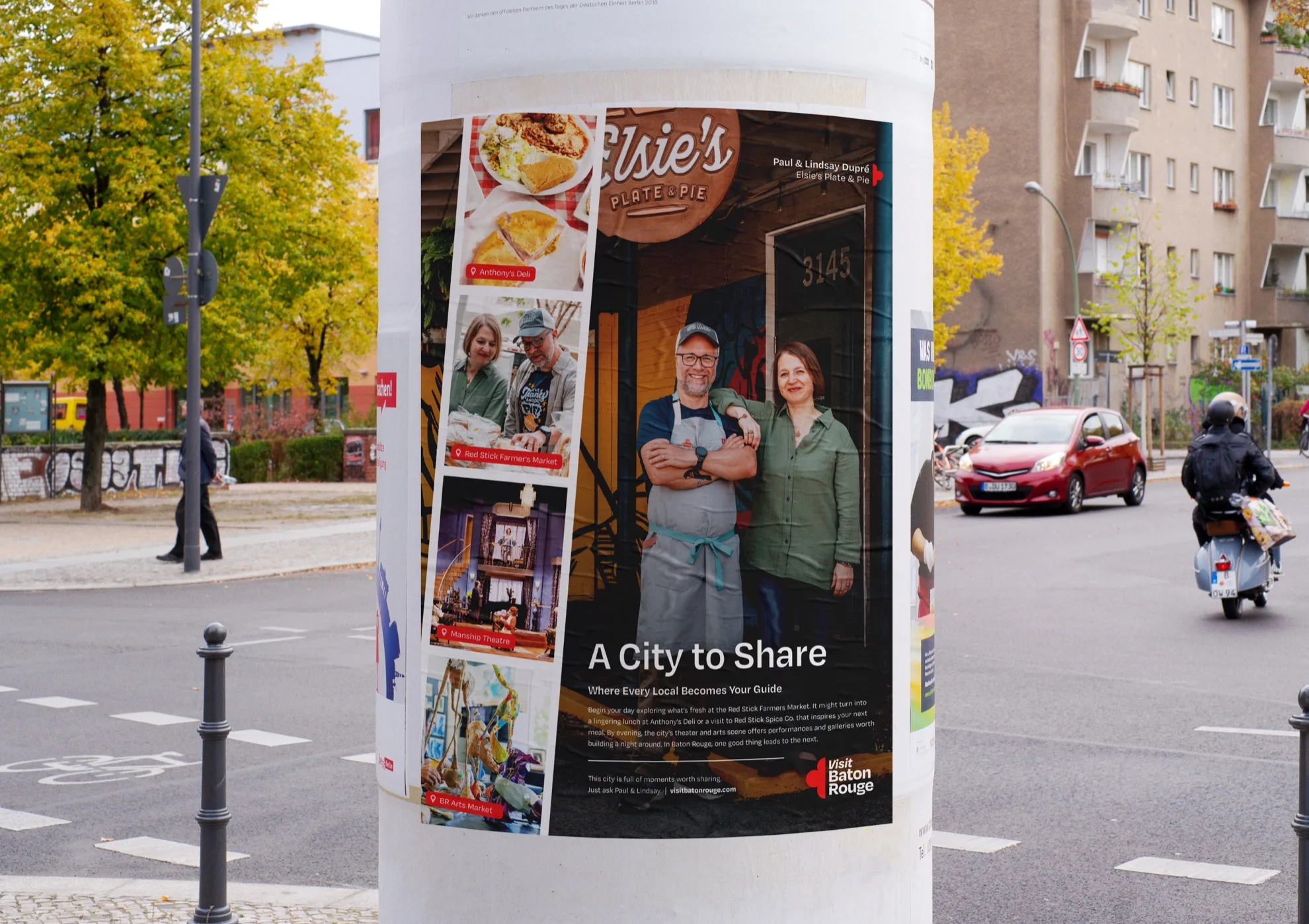 A Visit Baton Rouge A City to Share poster wrapped around a street column