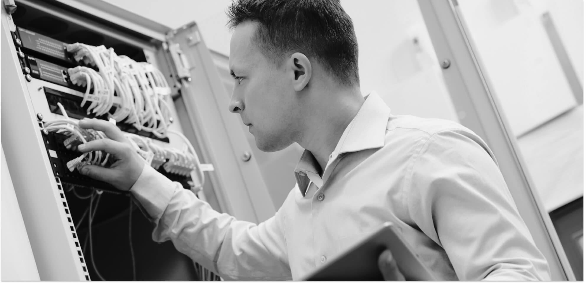 man inspecting hardware