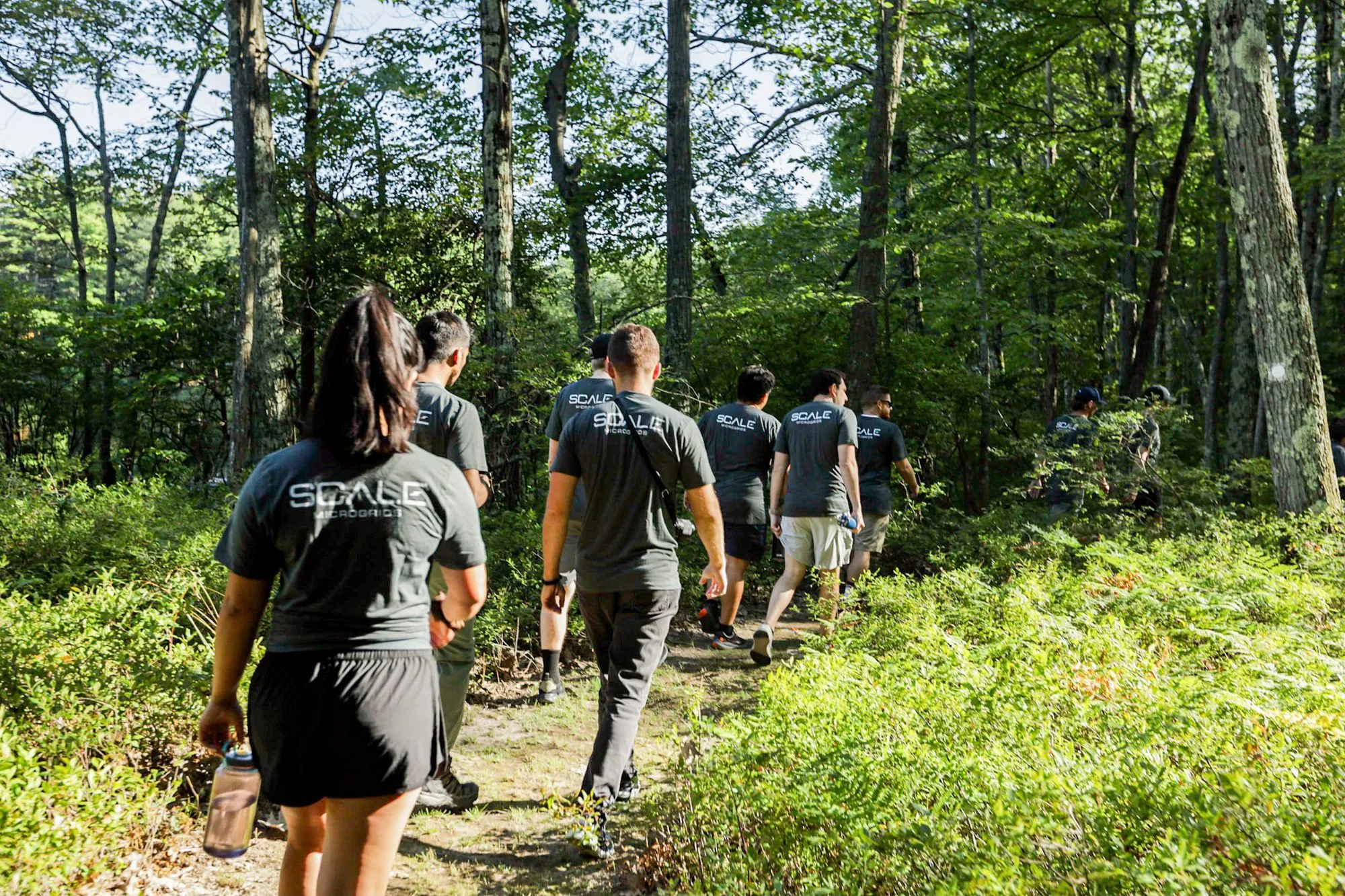 scale microgrids team walking on a trail