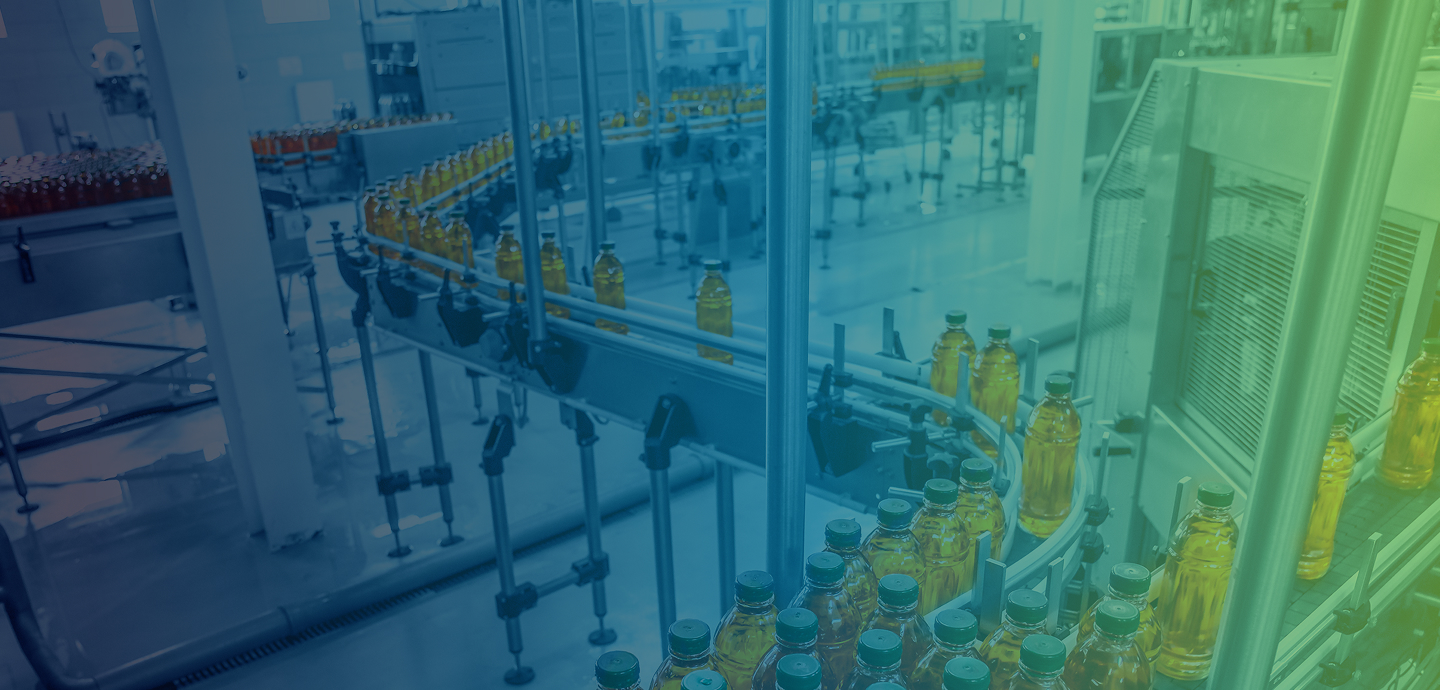 A food processing plant with conveyor belts moving bottles around with a blue to green transparent overlay.