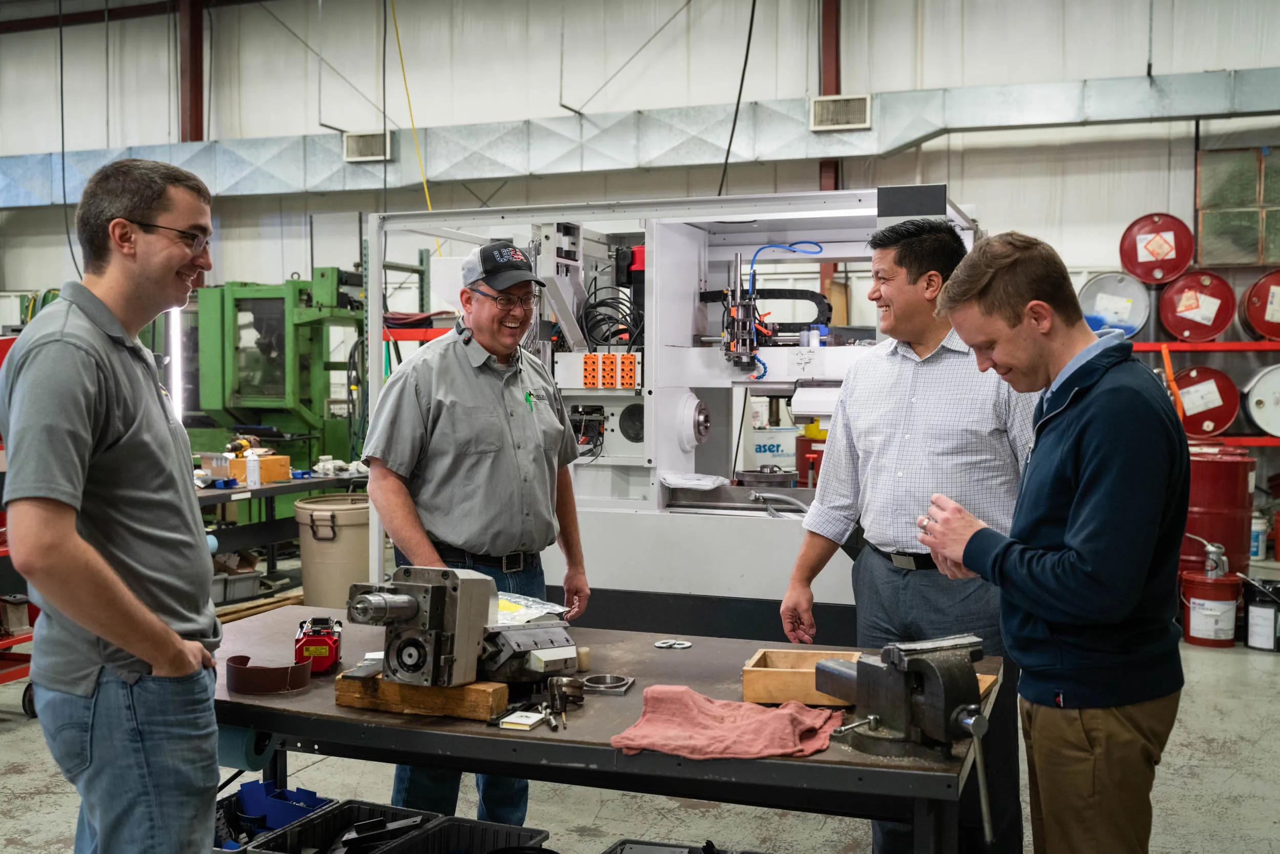 The Helios Gear Products team discussing a hobbing machine rebuild with a customer