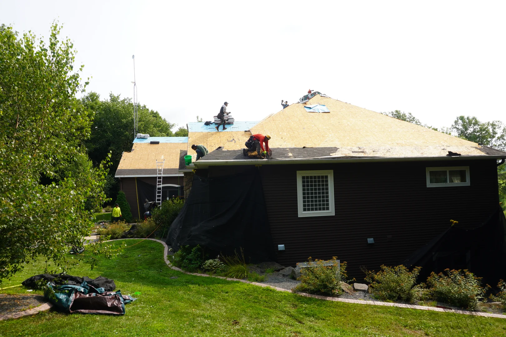 Certified roofing crew installing shingles on a home in Wausau Certified roofing crew installing shingles on a home in Wausau