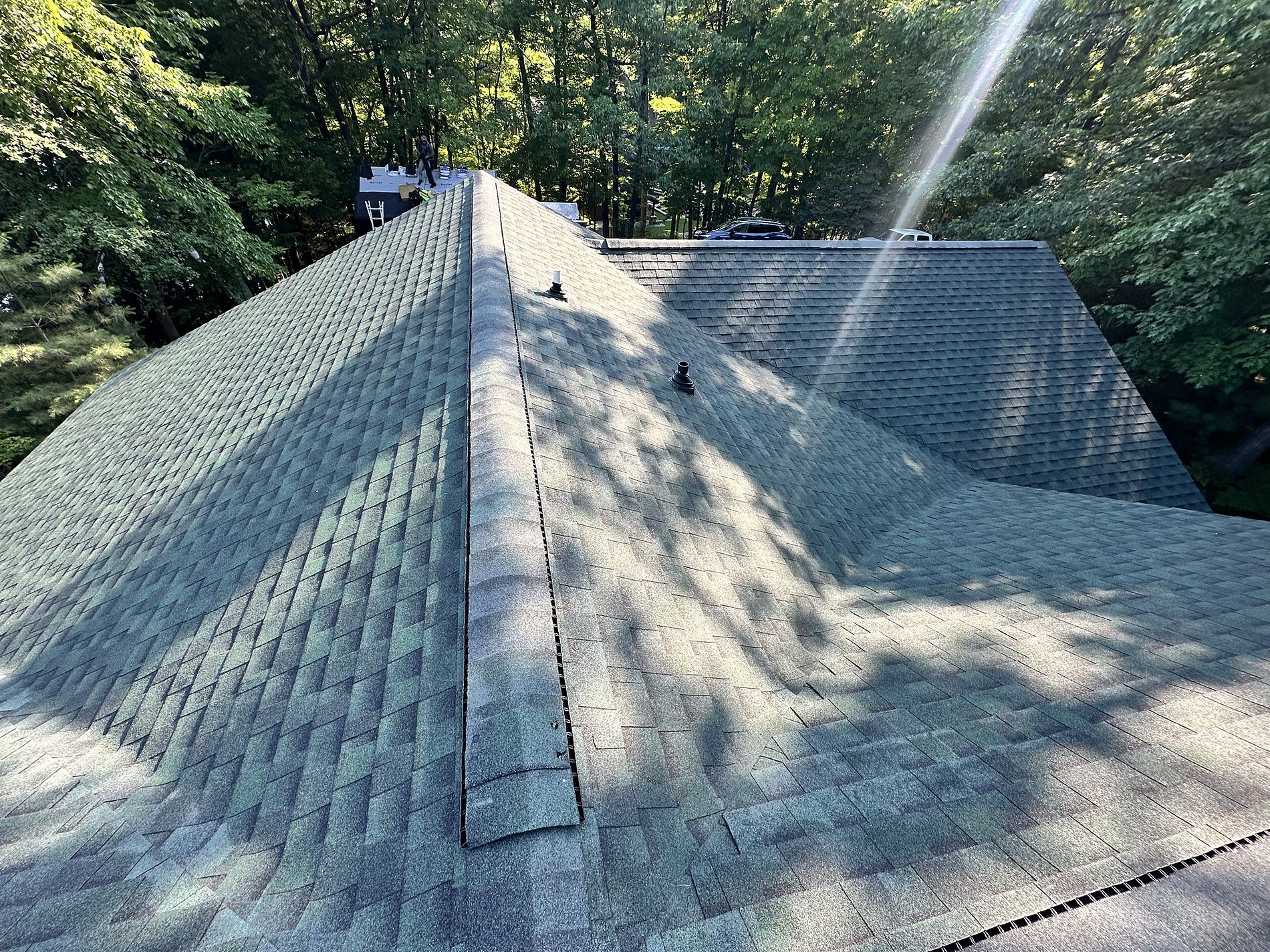 GAF Hunter Green roof replacement in Rhinelander, WI on a wooded home with updated shingles and clean rooflines.