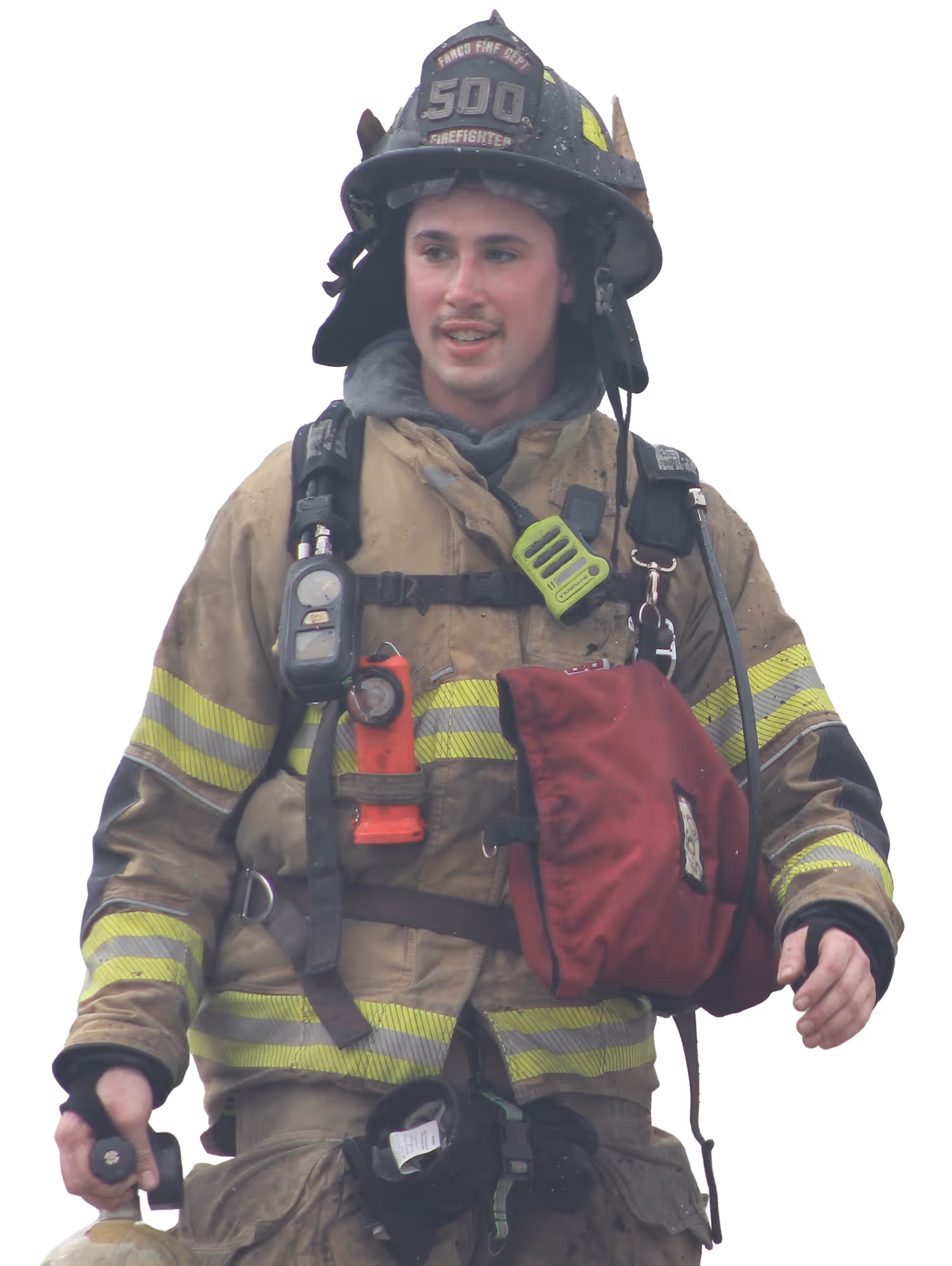 Firefighter wearing full gear and helmet carrying a coiled fire hose over one shoulder and holding a fire axe.