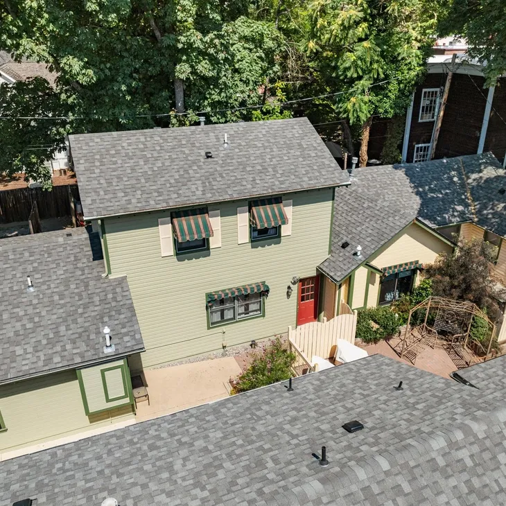 The Mooney cottage exterior — a two-story 1-bedroom rental at Heritage Cottages in Jacksonville, Oregon
