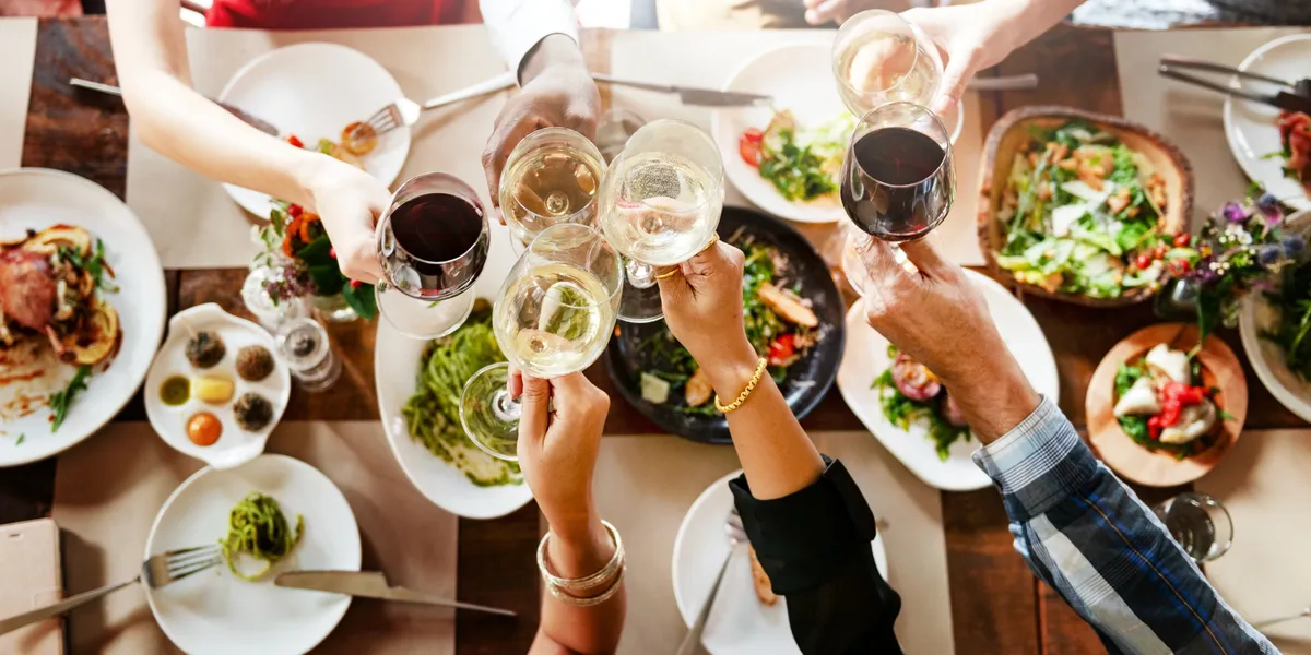 Friends enjoying wine and farm-to-table dining near Jacksonville, Oregon