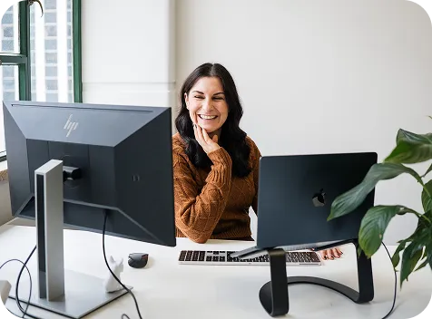 Woman at computer screens
