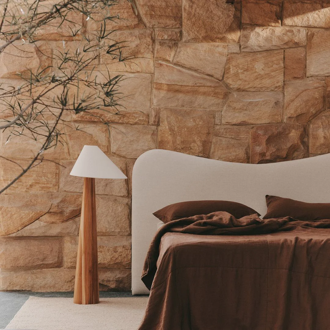 A counter-piece to the minimalism era — arguing that the luxury market has swung decisively toward warmth, texture, and livability. Traces the shift through materials (limewash plaster, honed stone, bouclé), palette (warmer neutrals replacing cool greys), furniture forms (curves over geometry), and lighting (layered atmospherics over single pendants). The underlying thesis: post-pandemic, clients stopped wanting to live inside a concept and started wanting to feel genuinely at home.