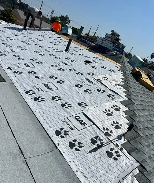 Synthetic roof underlayment installation for deck protection and moisture barrier on residential roof in South Gate California