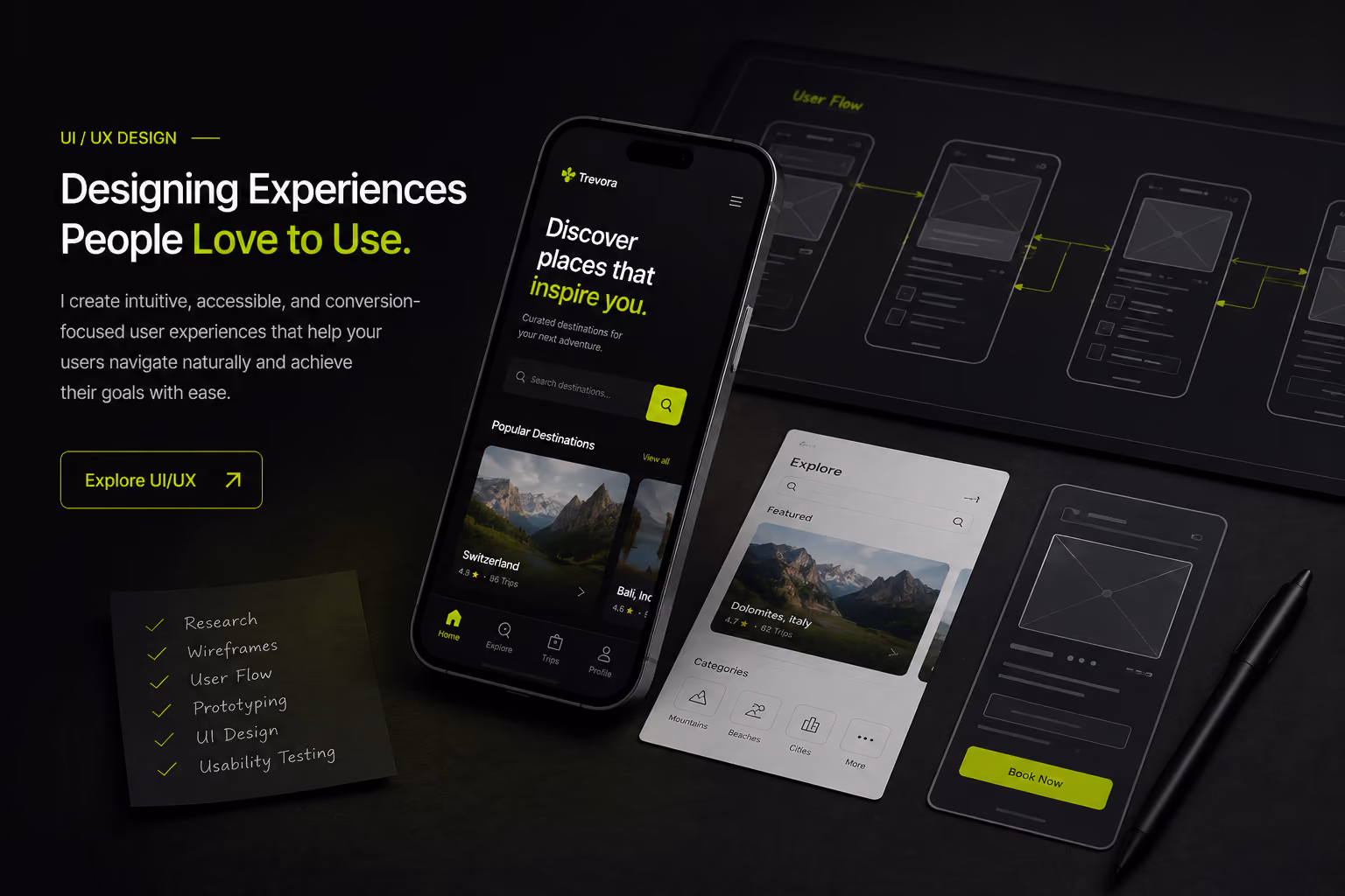 Dark-themed UI/UX design display with phone screens, wireframes, user flow, and a pen on desk.