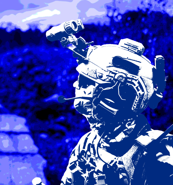Soldier wearing a tactical helmet with mounted night vision goggles and communication gear.