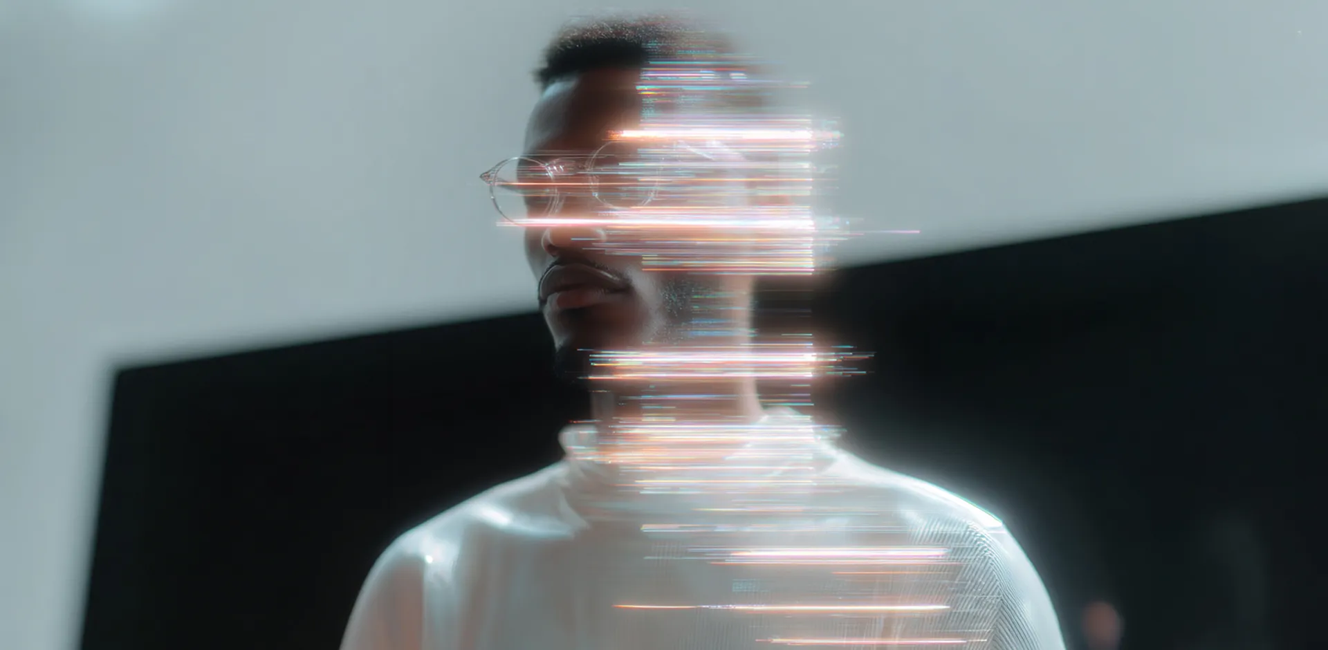 Smartphone with a blank white screen placed on a tufted cream leather surface next to crumpled brown leather.