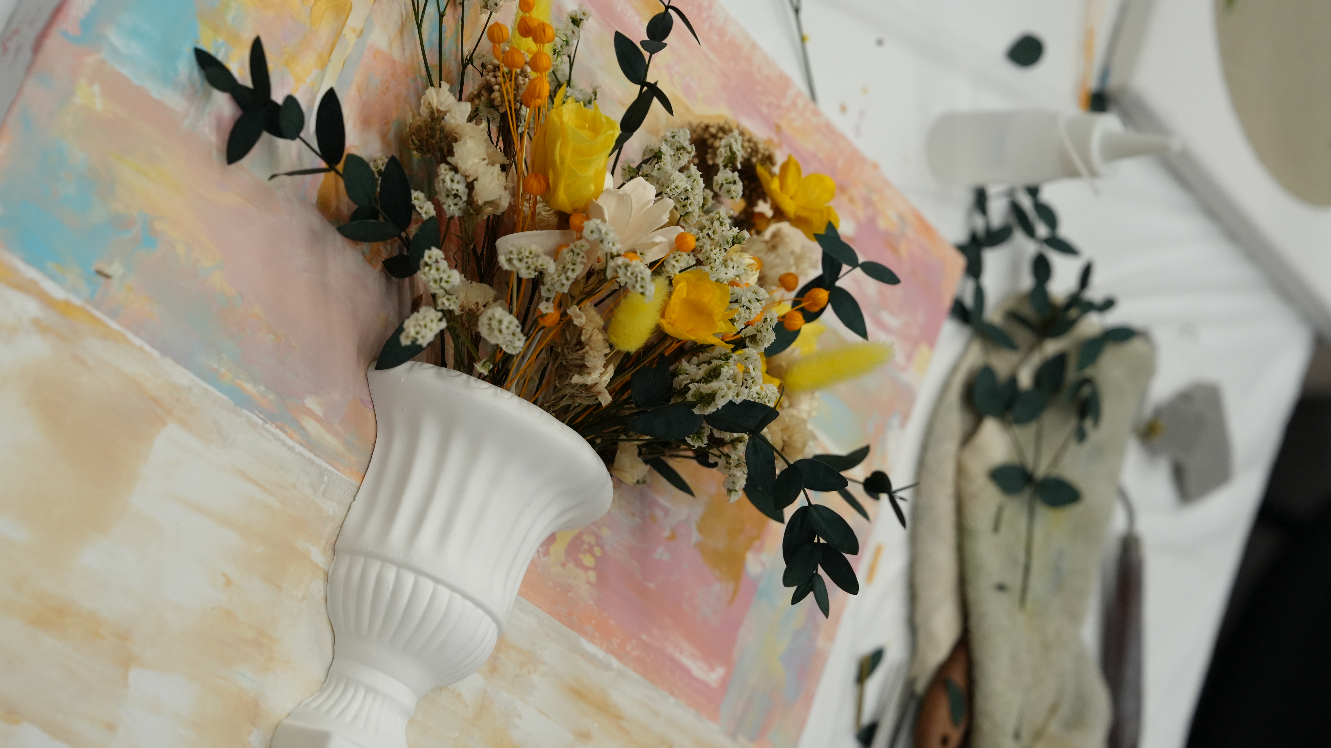 Dried floral arrangement detail with styling vase