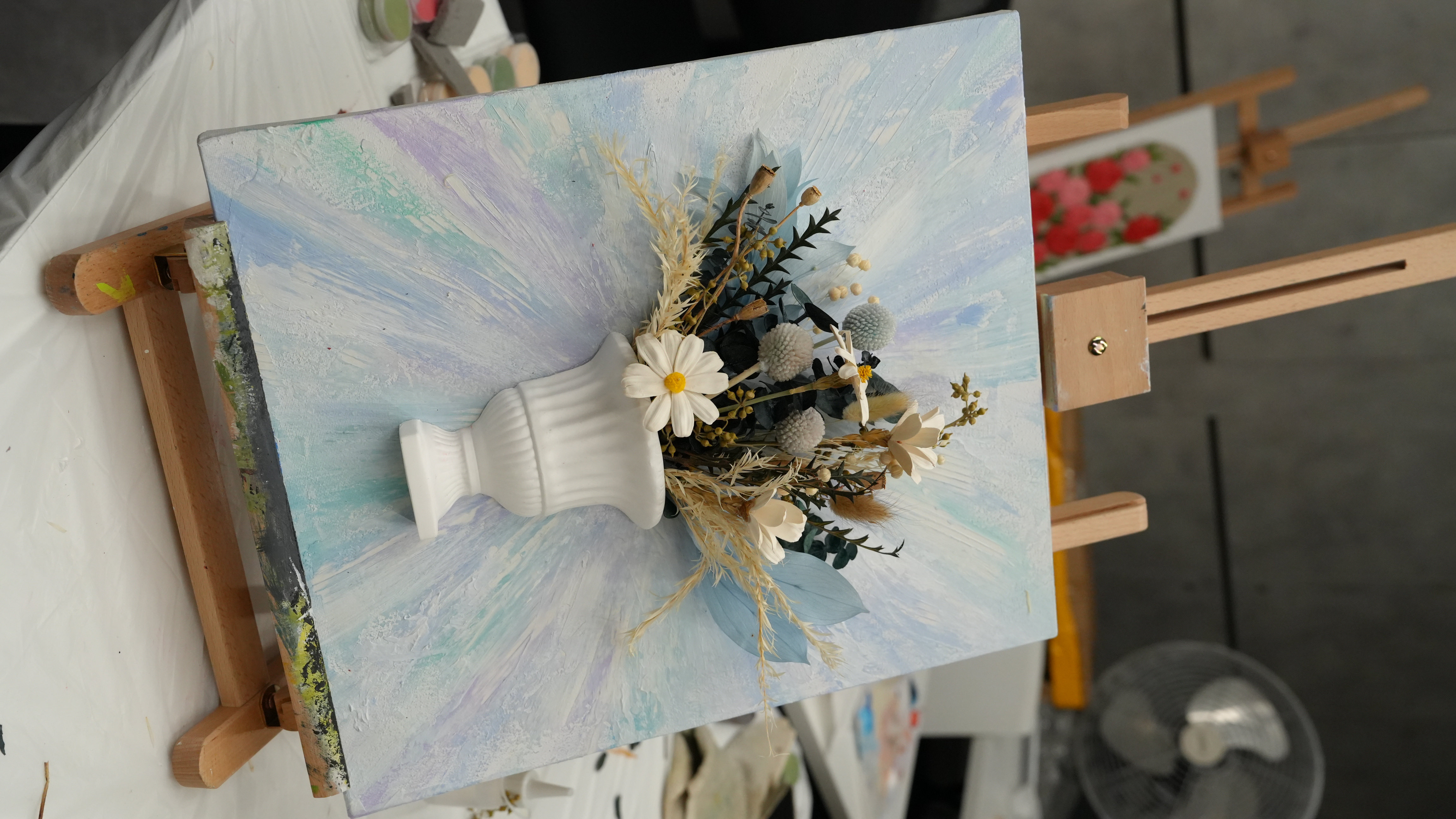 Finished dried floral textured art piece styled in a vase