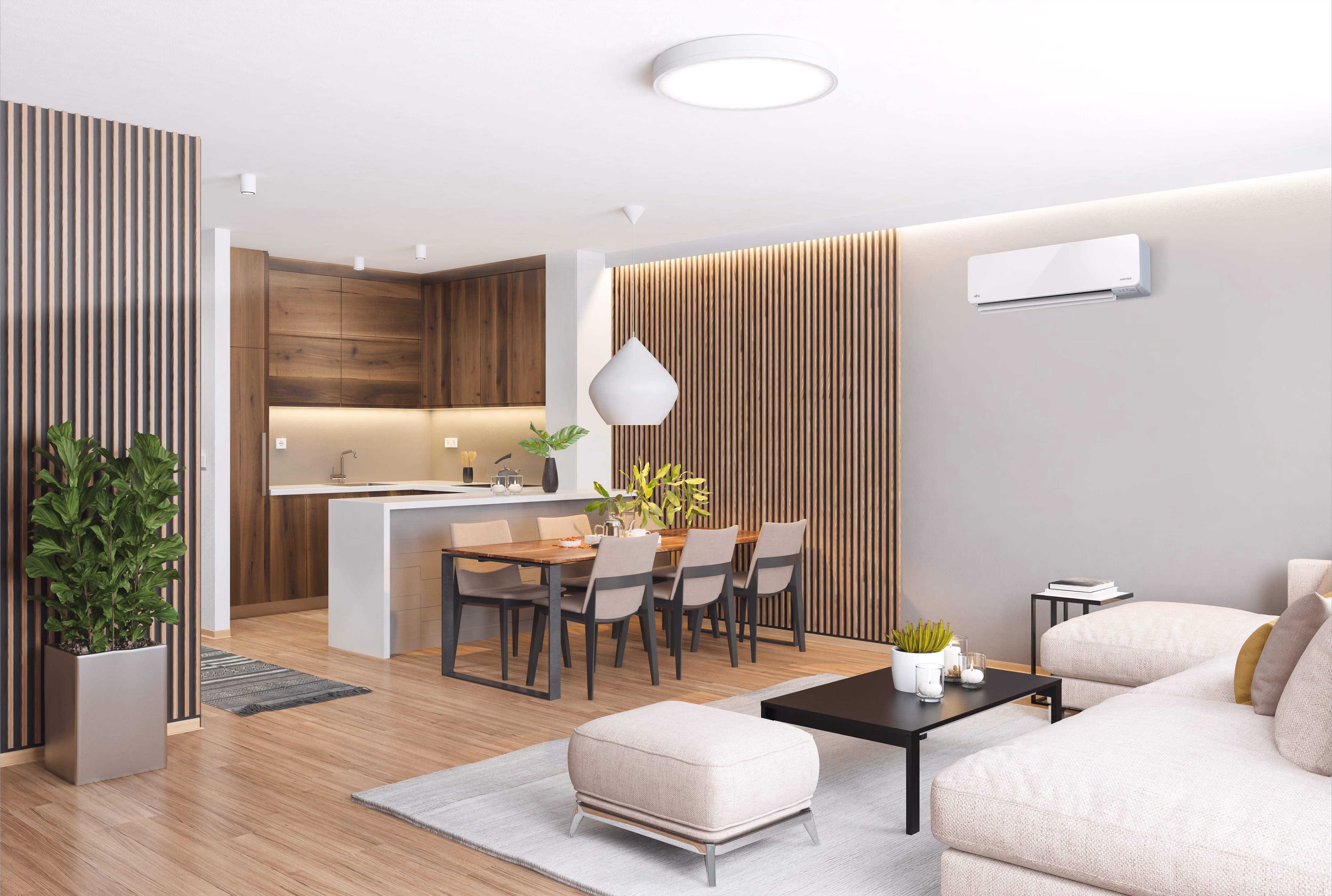 Modern living room and kitchen with dark gray sectional sofa, wooden dining table, and marble island.