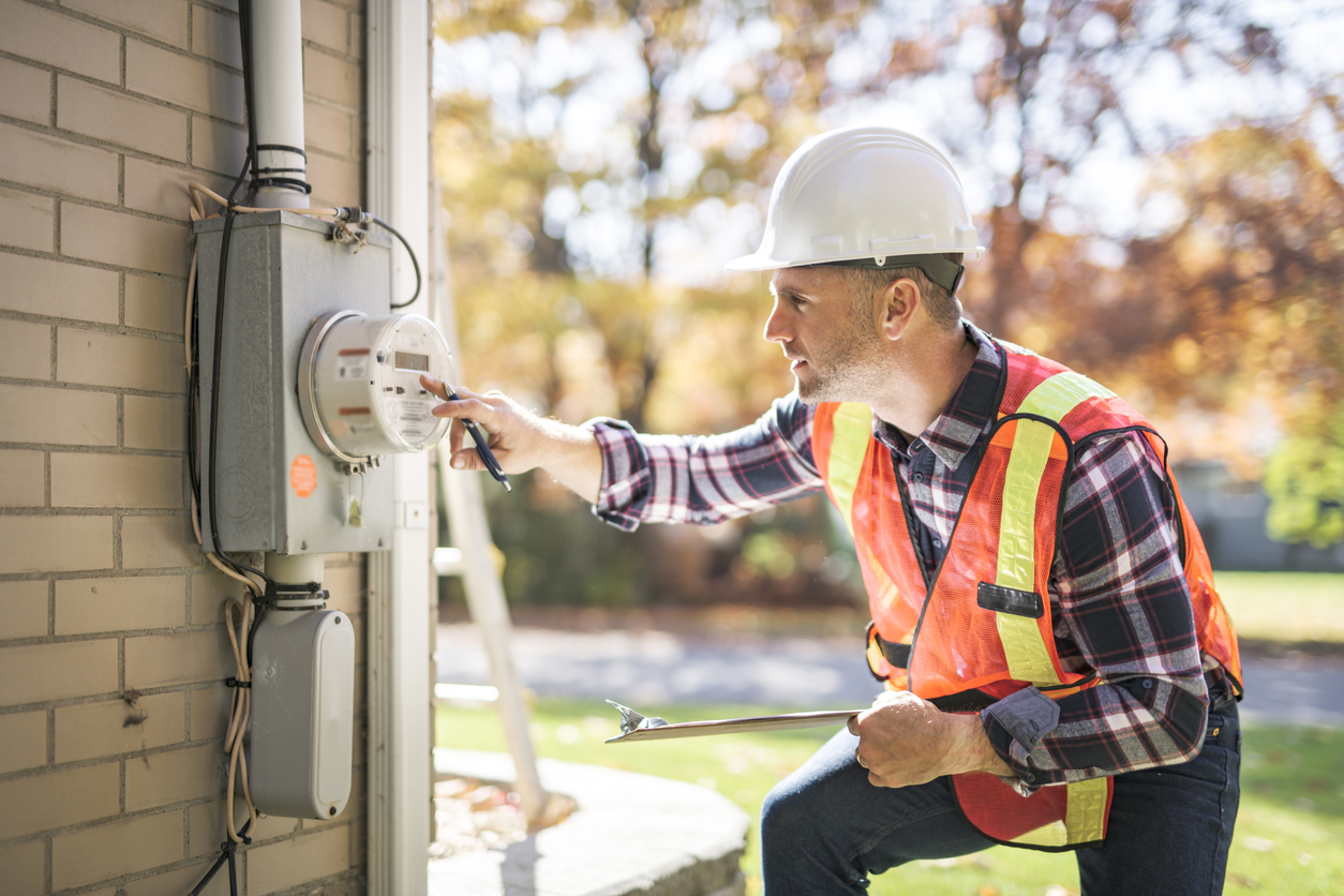 Residential service electrician working on a home electrical panel