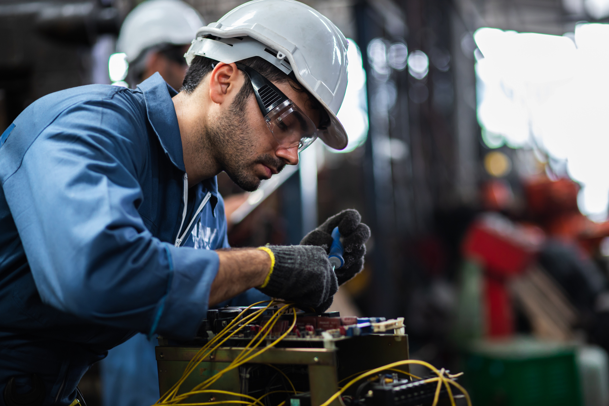 Technician working on electrical control wiring