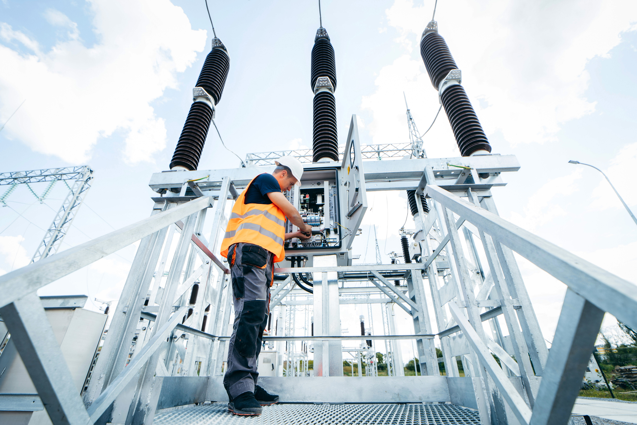 Electrical contractor working on a substation structure