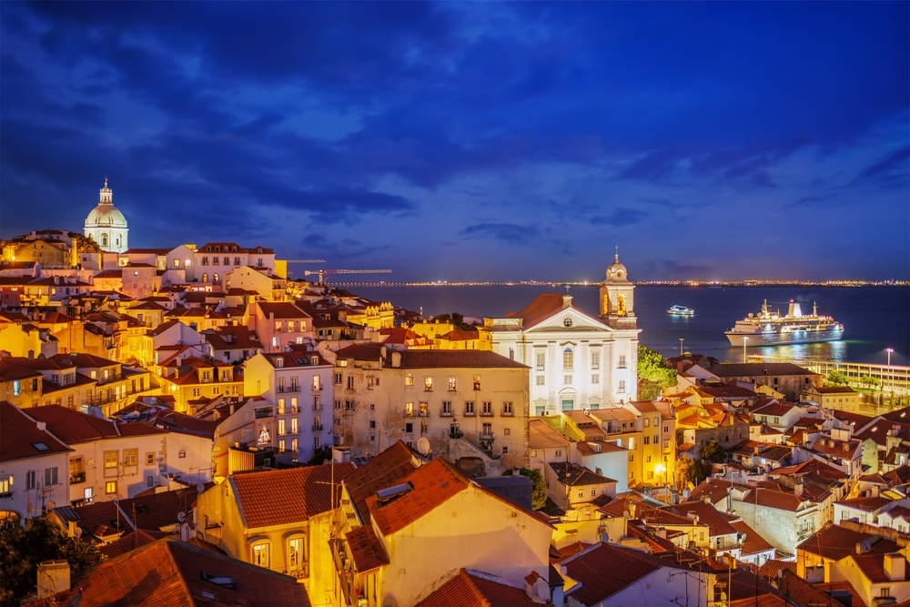 Aerial view over Lisbon skyline at night