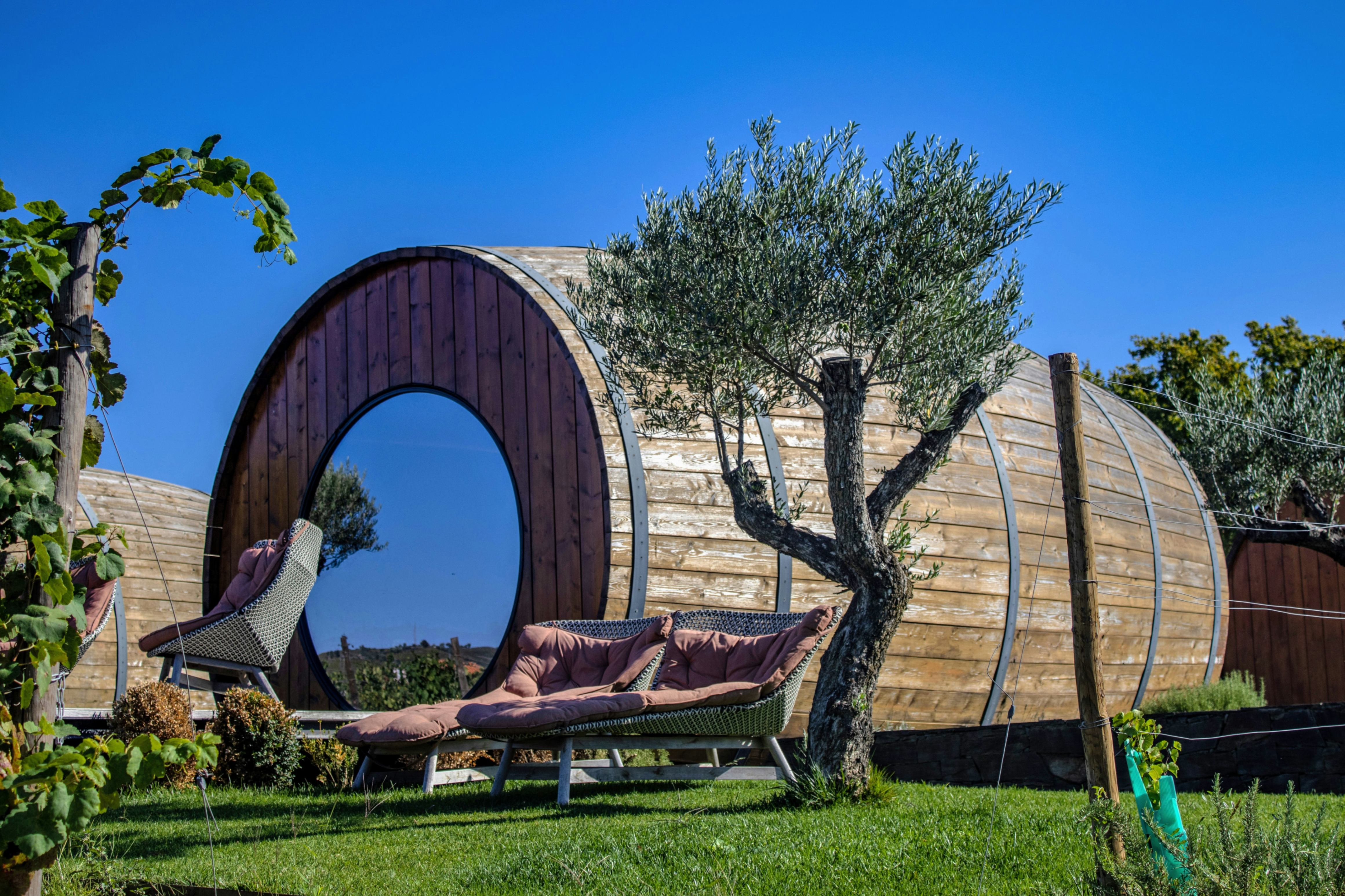Unique wine barrel-shaped suites nestled in the vineyards of a Douro Valley estate