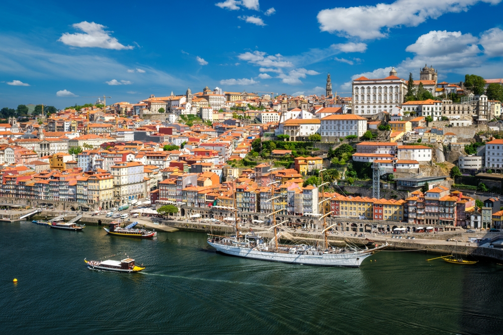 Aerial view of Porto and Douro river with moored sailing ship from Dom Luís I Bridge