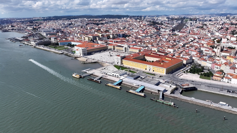 Lisbon's historic waterfront with Praça do Comércio square and city skyline by the Tagus River