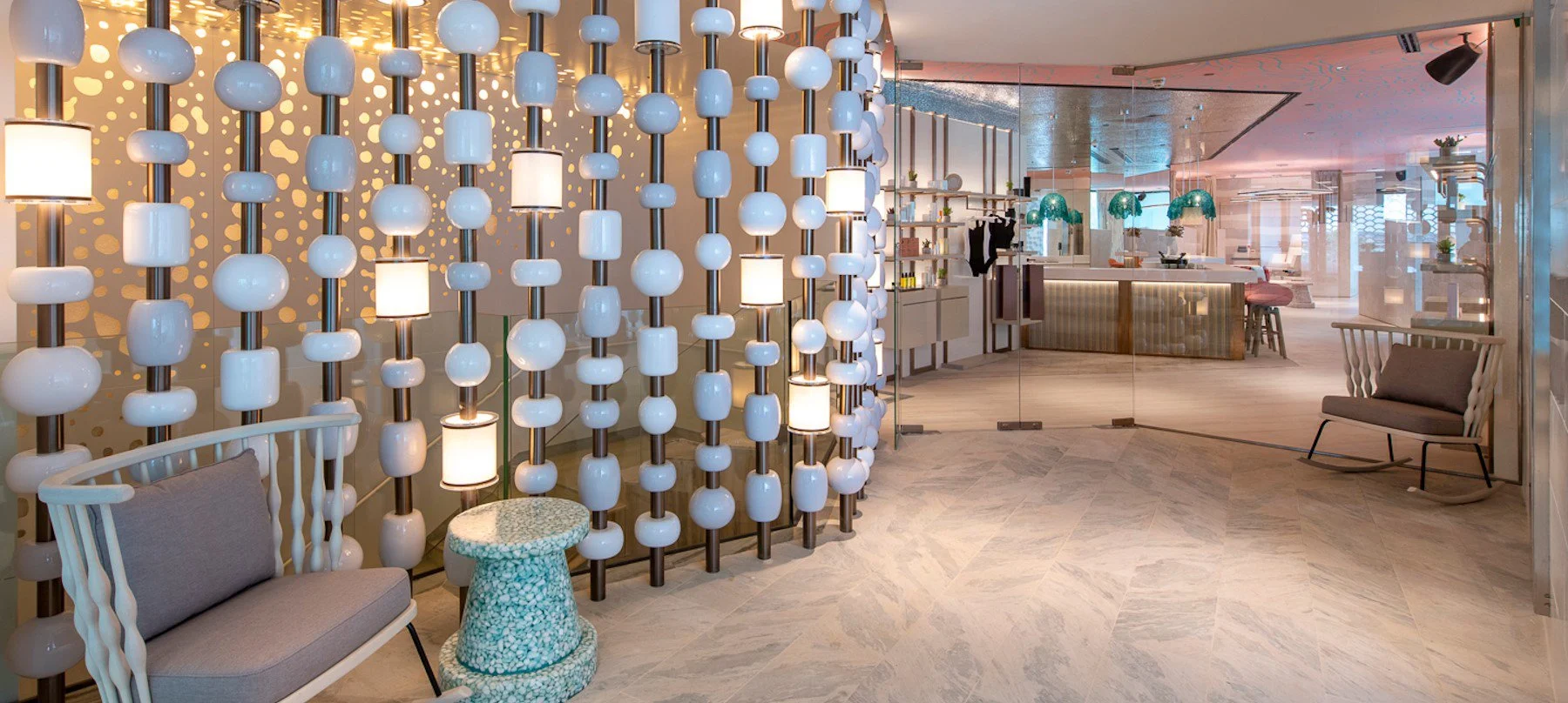 Modern, brightly lit luxury spa or hotel interior with stylish decorative lighting
