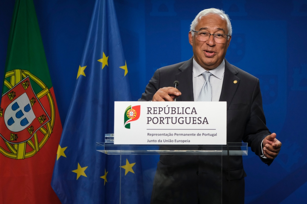 Former Portuguese Prime Minister Antonio Costa standing behind a clear lectern