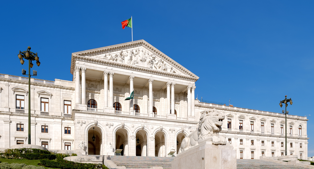 Portuguese flag flying atop the facade of Sao Bento Palace building of the Portuguese Parliament