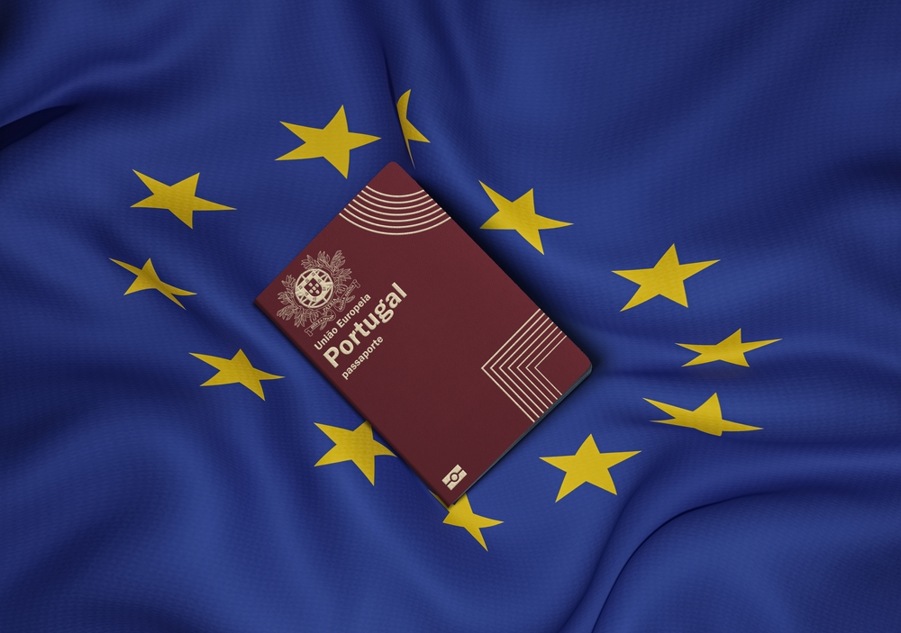A Portugal passport on top of an EU flag
