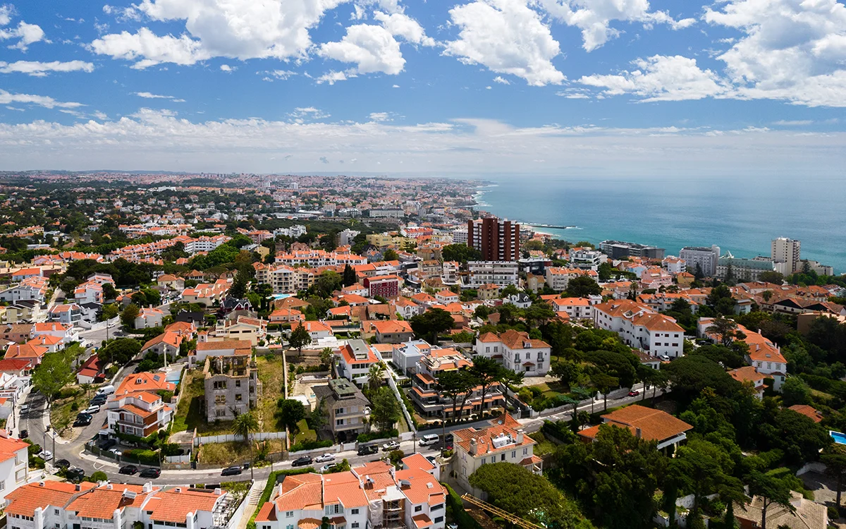 Coastal town of Estoril showing residential neighbourhoods and the blue Atlantic sea
