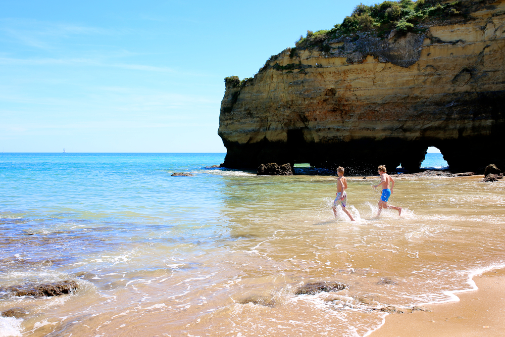 Children playing in the sea at Portuguese beach