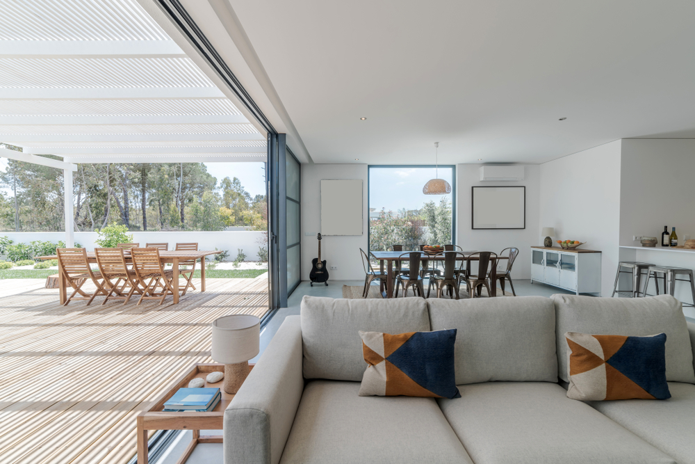 Luxury home interior with large windows and a view of the garden.