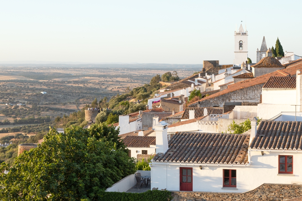 Historic white village and landscape in Portugal's Alentejo region.
