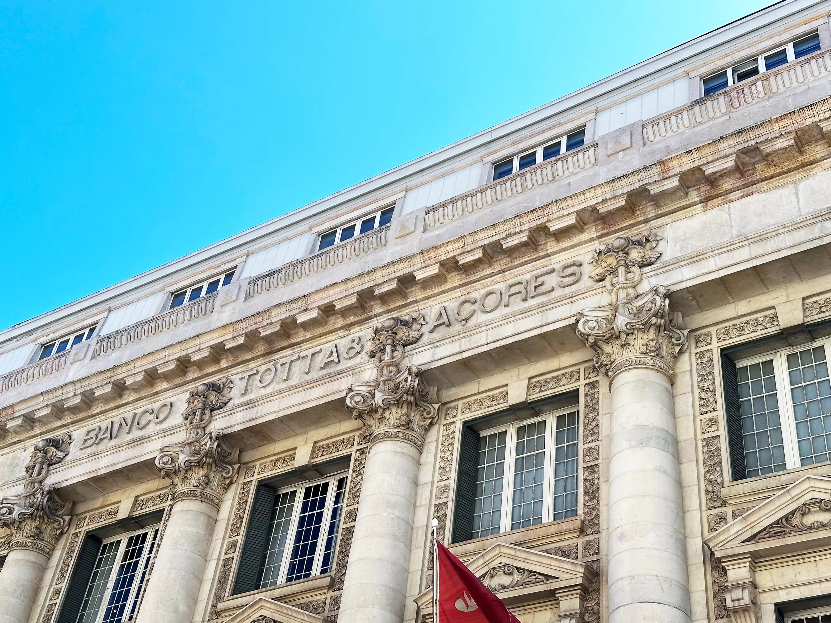 Bank façade in Portugal featuring classical architecture and ornate details.