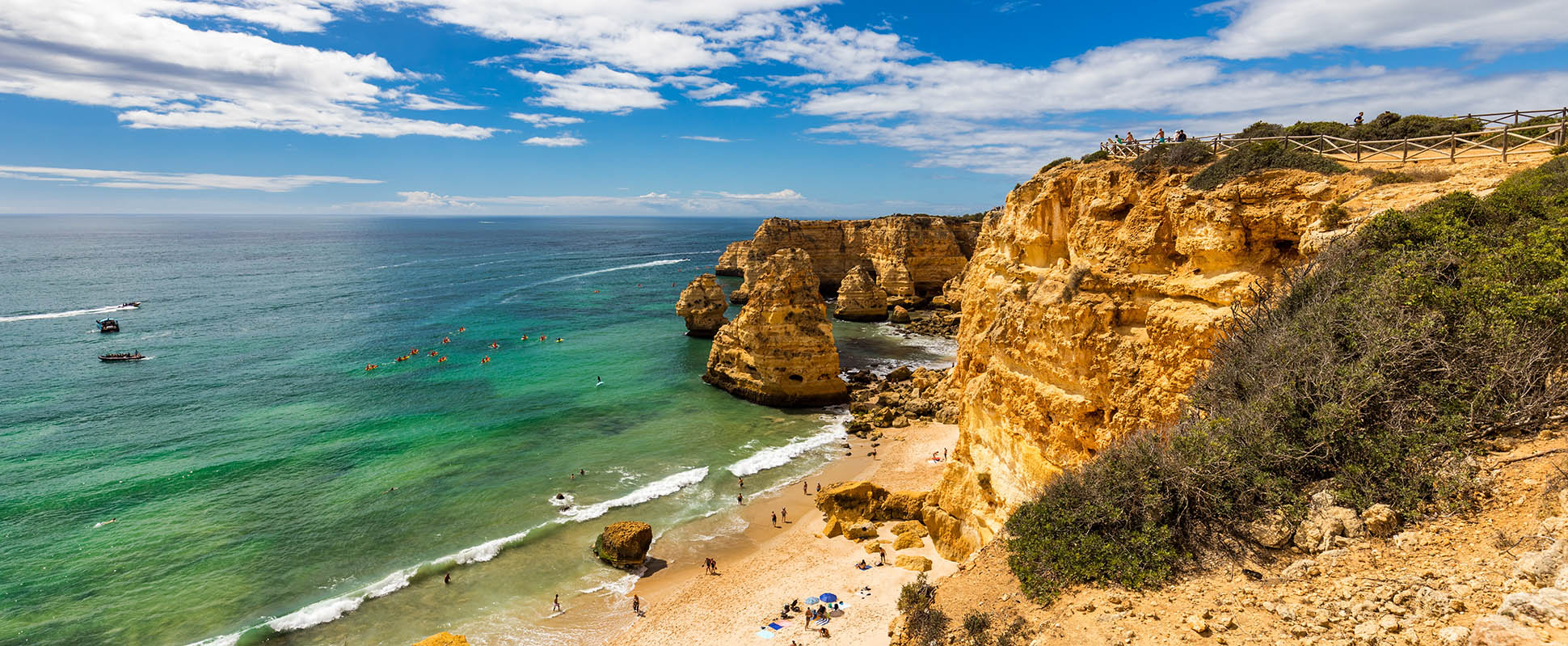 Coastal cliffs and beach in Lisbon, Portugal, illustrating investment potential.