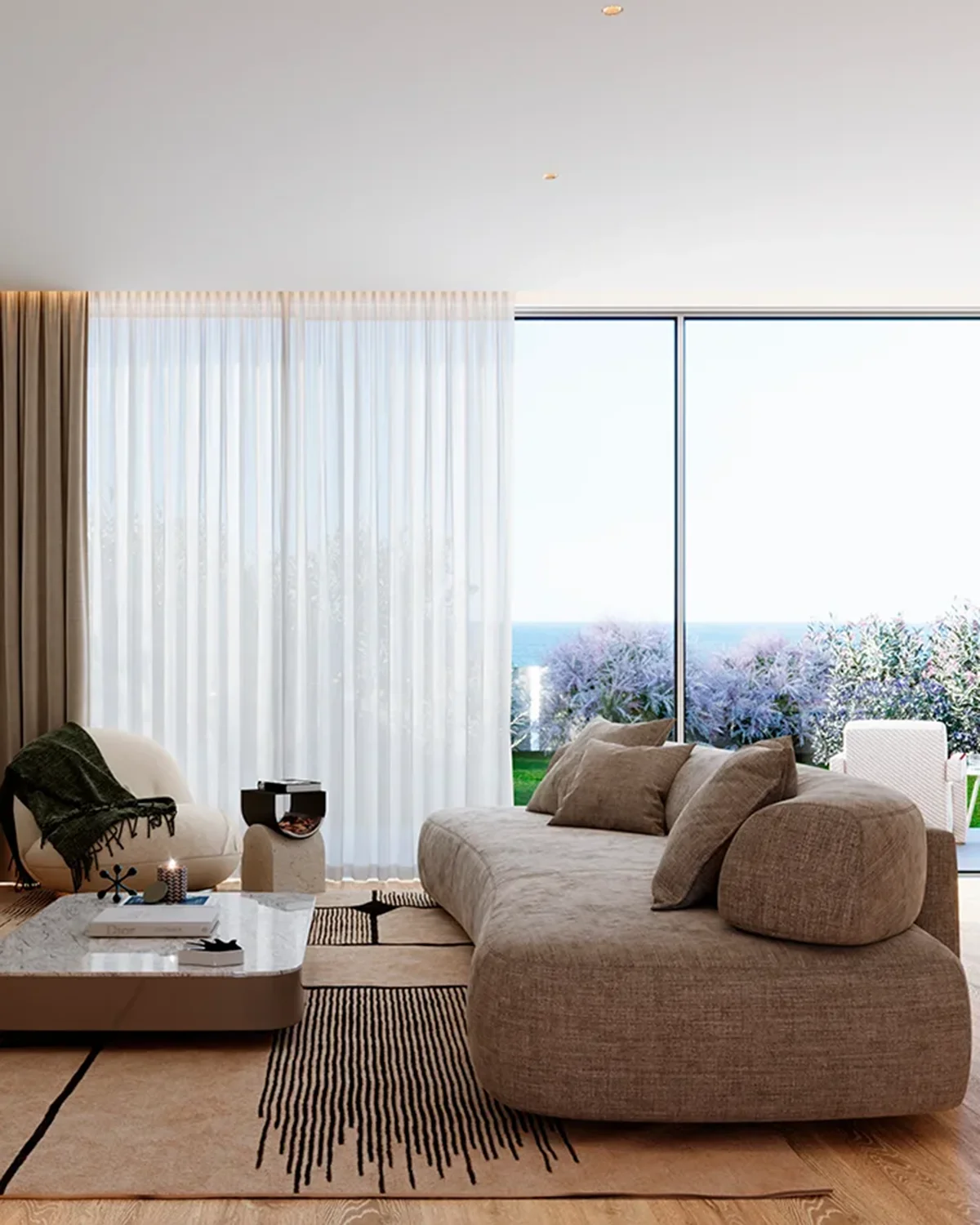 Luxury Estoril apartment interior with ocean view and modern sofa.