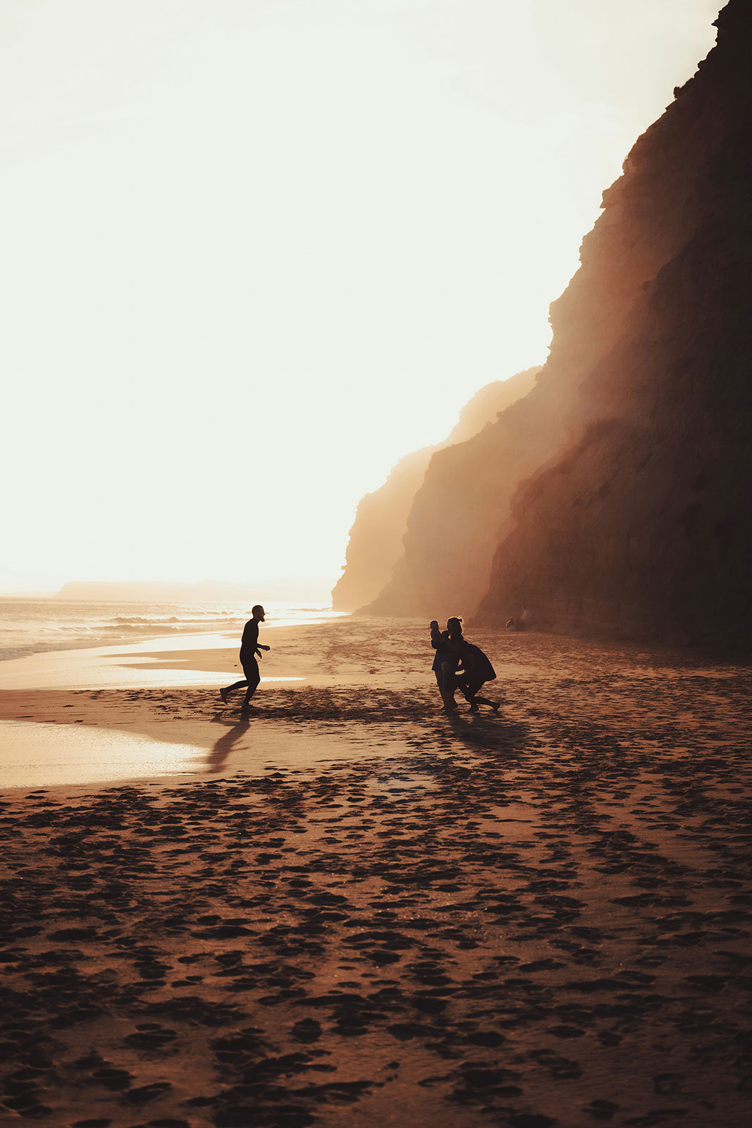 Family enjoying a beach in Portugal, showcasing safe travel destination and regional exploration.