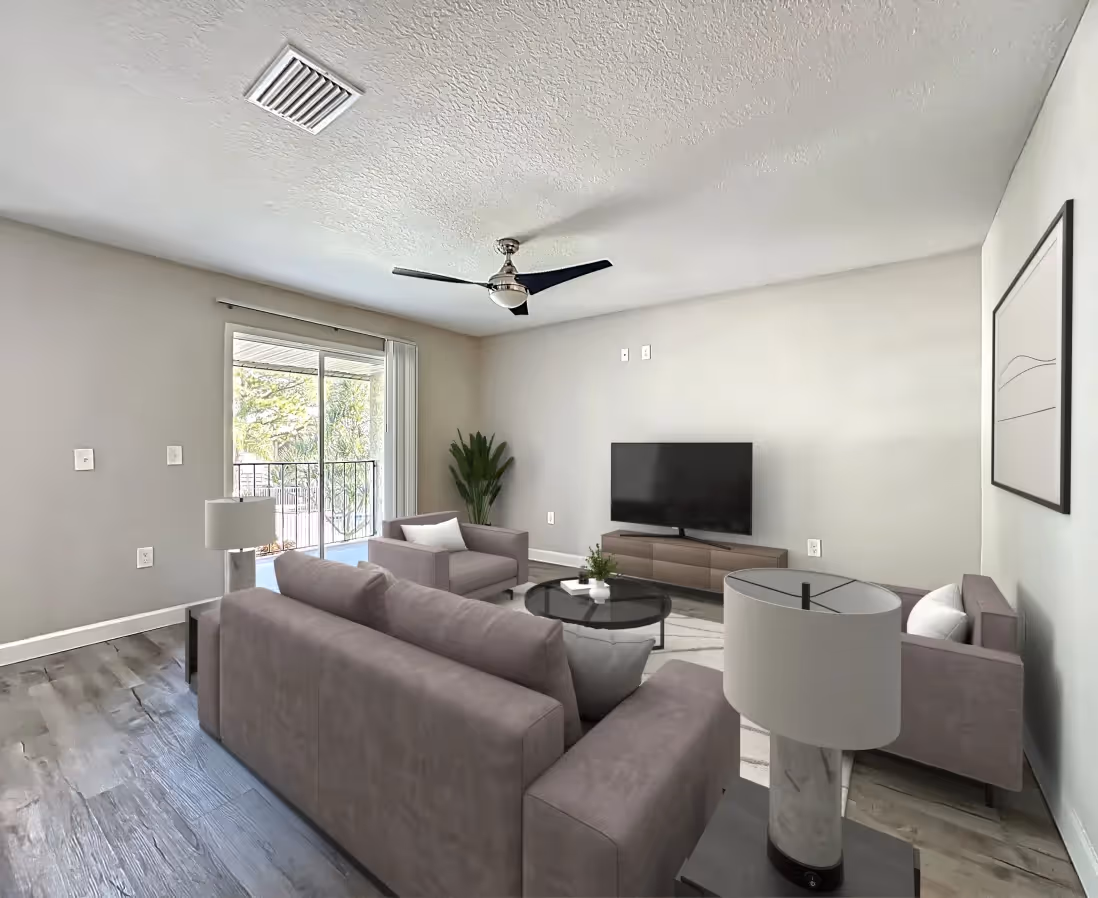 Living area with virtually staged sofa, coffee table, and tv