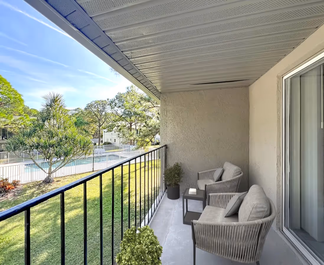 Balcony furnished with chairs