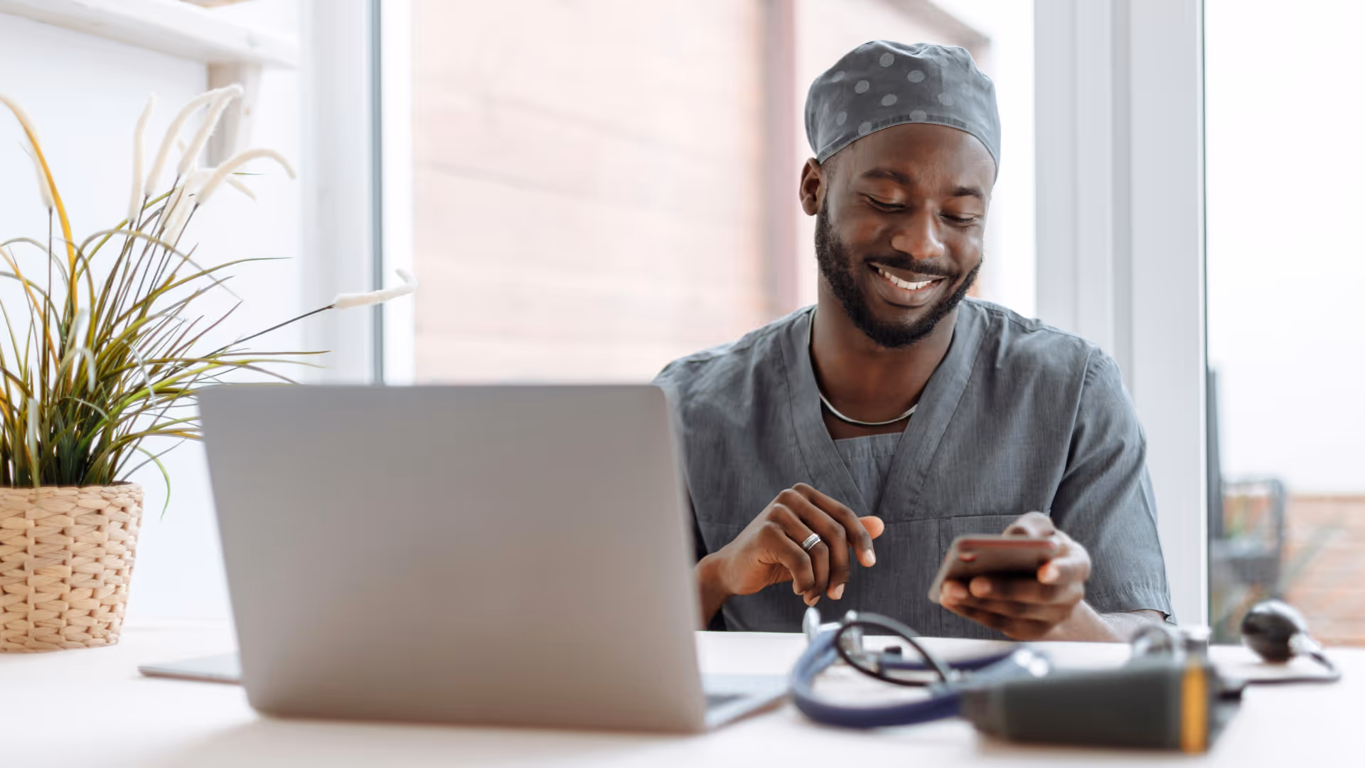 Man typing on computer with coffee stock image