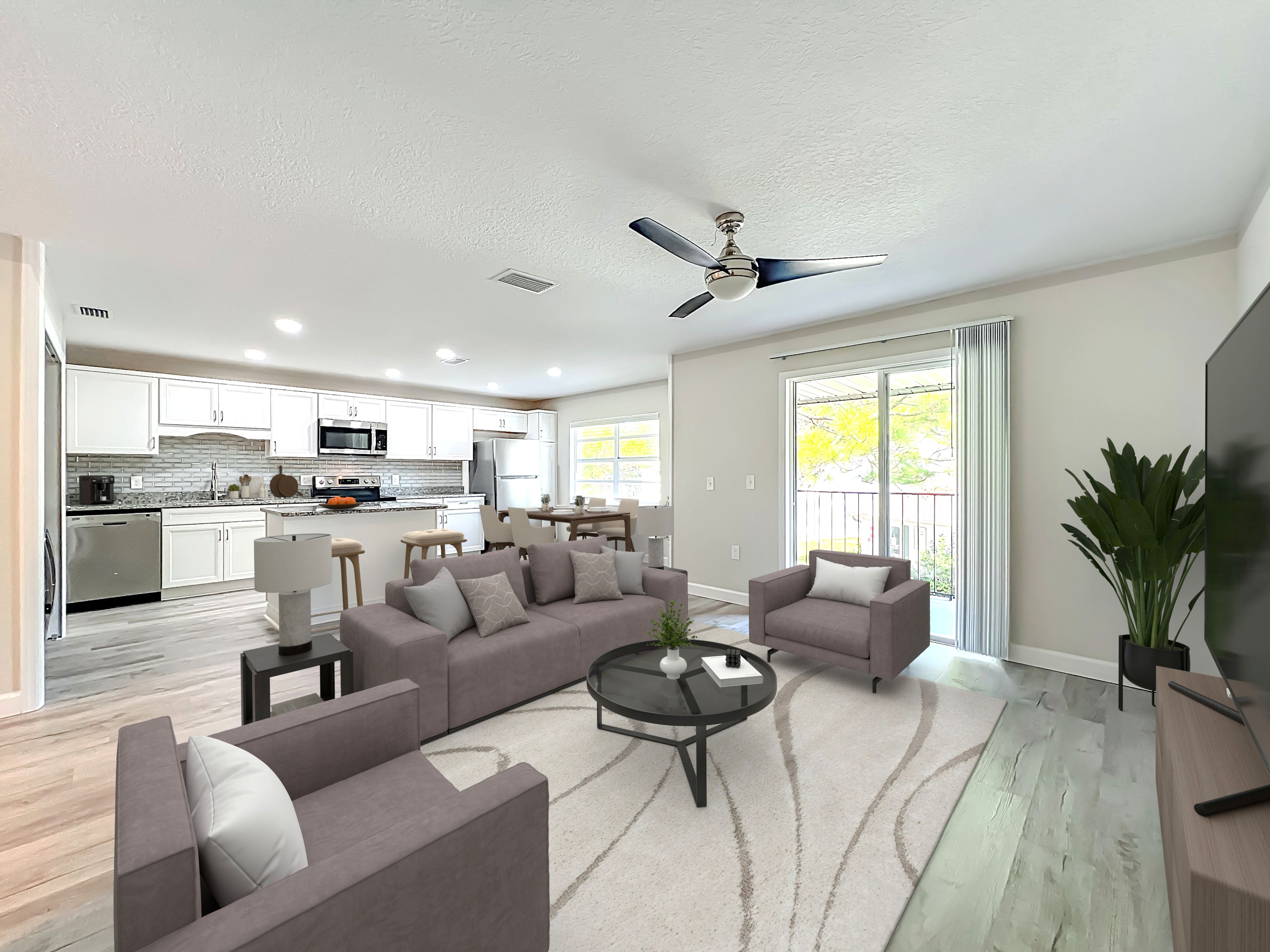 Living area with virtually staged sofa, coffee table, and chairs