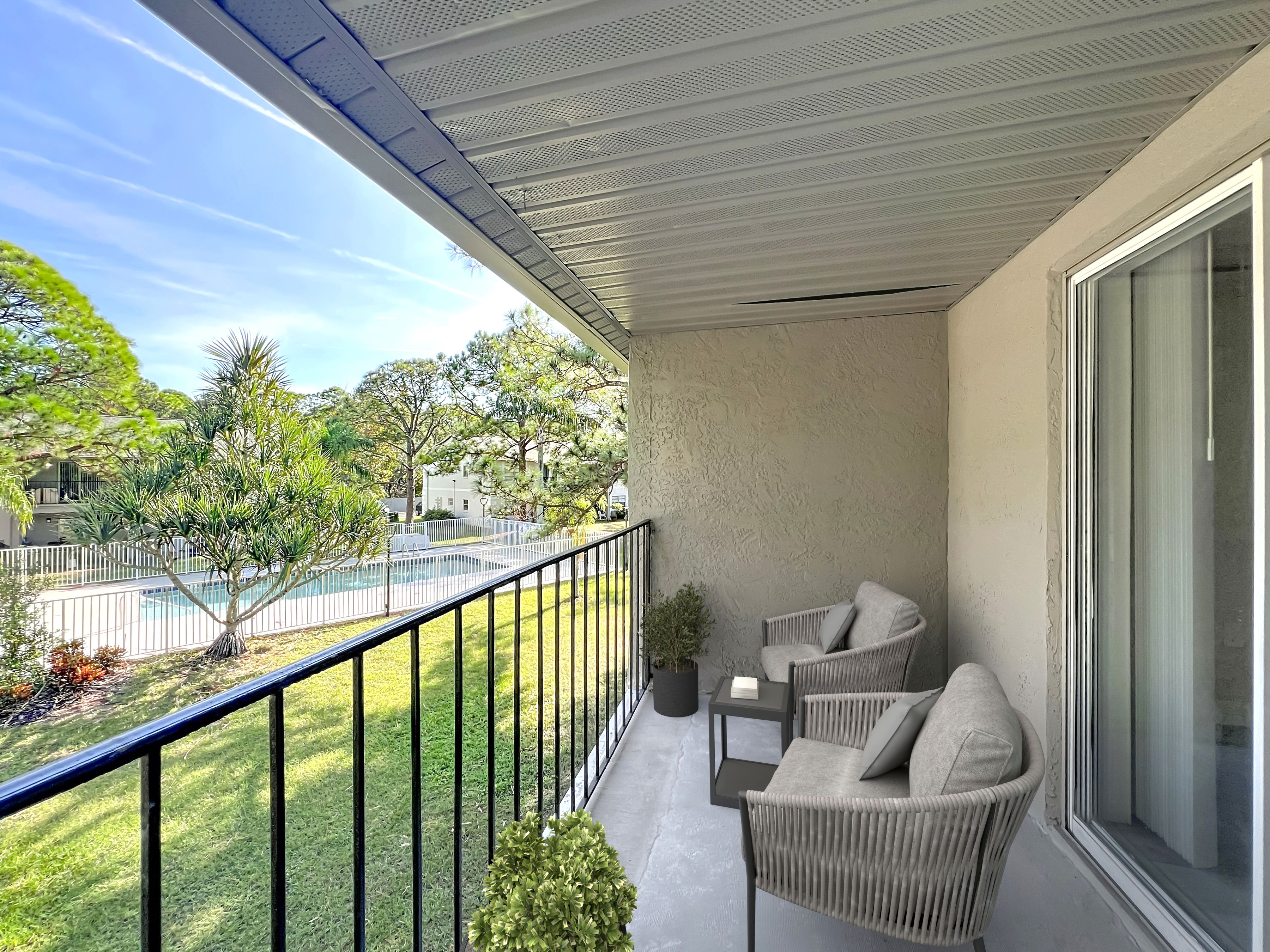 Balcony furnished with chairs