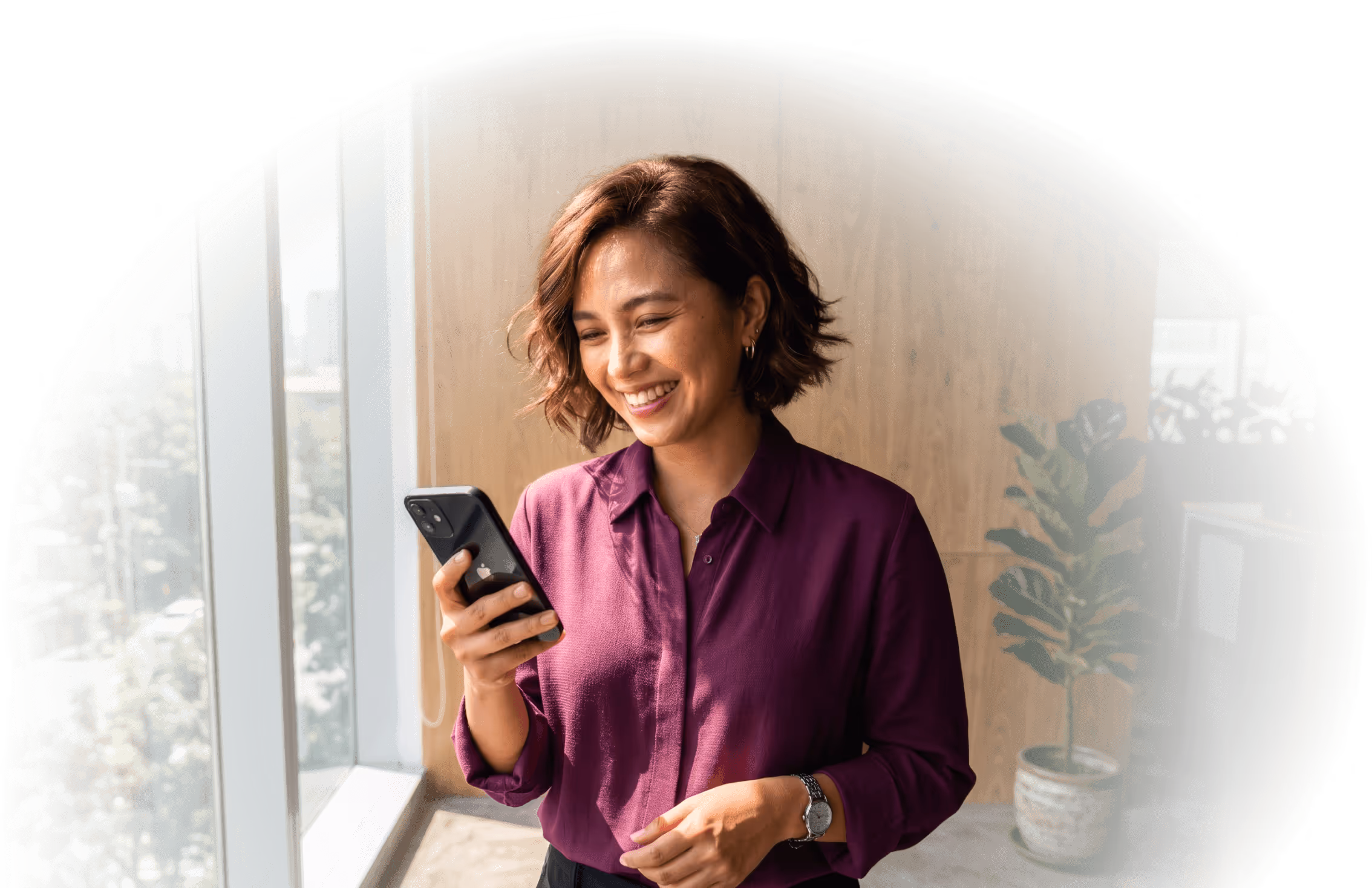 Woman using mobile banking app on her phone